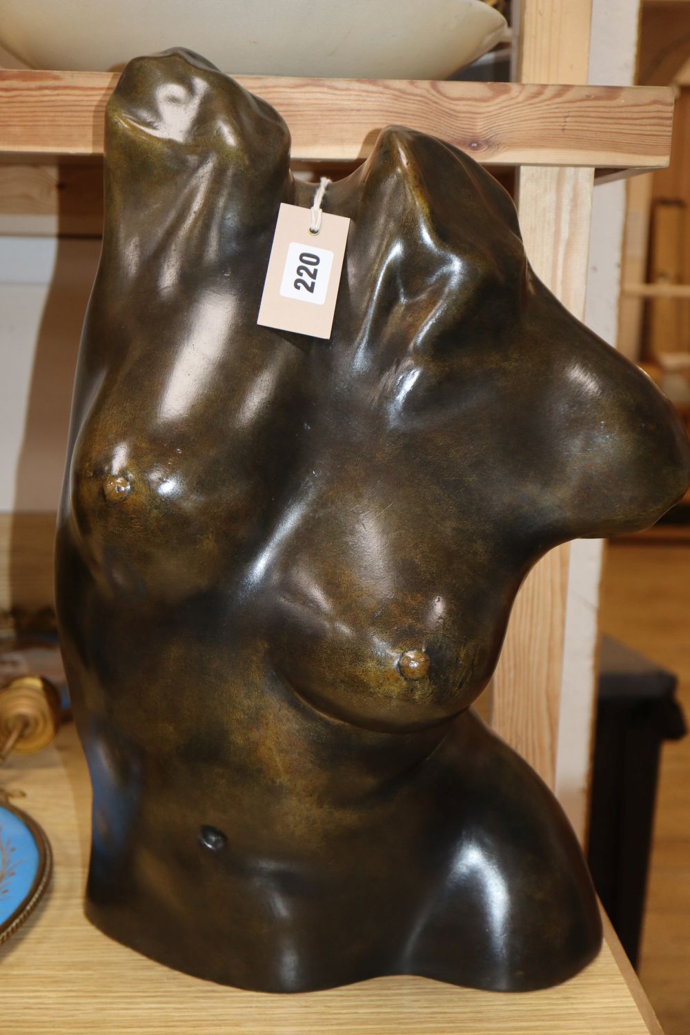 A bronze female torso, signed D. Claveric, height 47cm